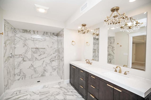 50 Newfields Rd Unit A, Exeter, NH 03833 - full bathroom featuring a chandelier, marble look tile flooring, double vanity, a marble finish shower, and recessed lighting