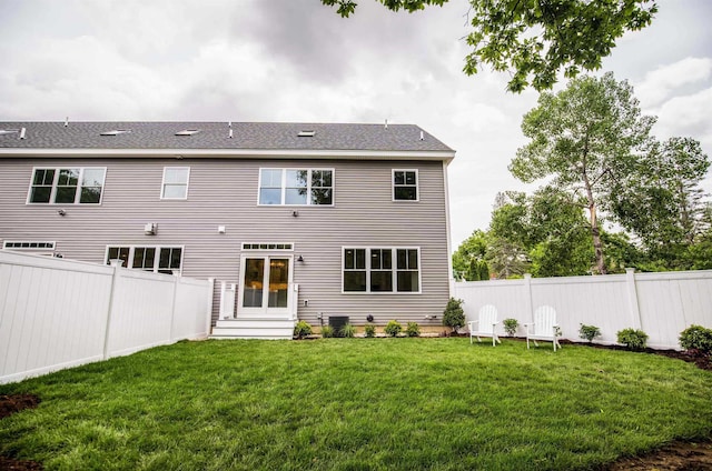 50 Newfields Rd Unit A, Exeter, NH 03833 - back of house featuring a fenced backyard and roof with shingles