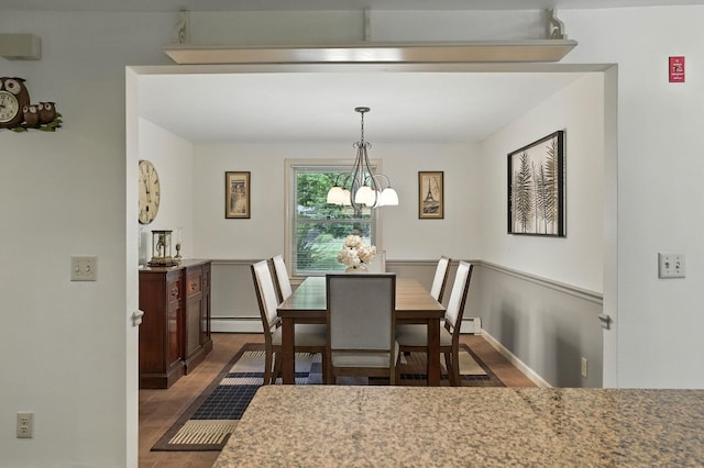 38 Cambridge Rd, Bedford, NH 03110 - dining space with wood finished floors, a chandelier, and a baseboard heating unit