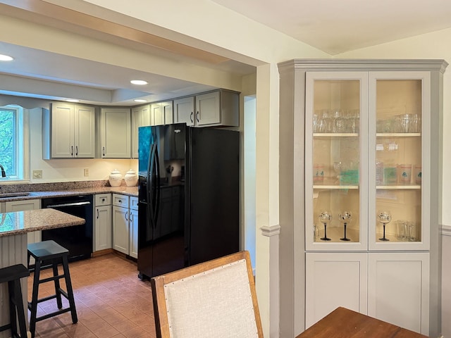 38 Cambridge Rd, Bedford, NH 03110 - kitchen featuring black appliances and dark stone countertops