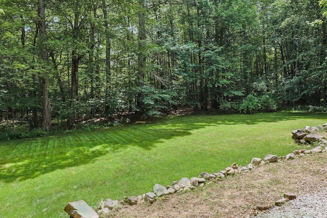 38 Cambridge Rd, Bedford, NH 03110 - view of green lawn featuring a view of trees
