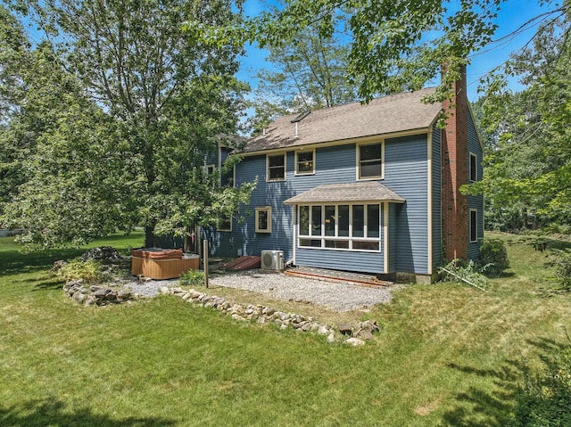38 Cambridge Rd, Bedford, NH 03110 - rear view of property with a hot tub, a chimney, a lawn, and a shingled roof