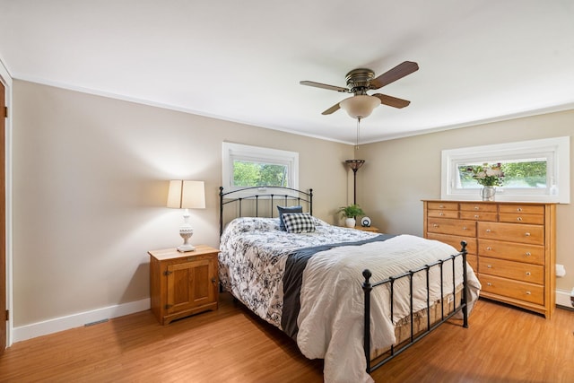 626 County Rd, New London, NH 03257 - bedroom featuring light wood-style floors, crown molding, and a ceiling fan