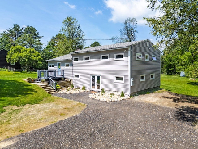 626 County Rd, New London, NH 03257 - back of property with a deck, a yard, and a chimney