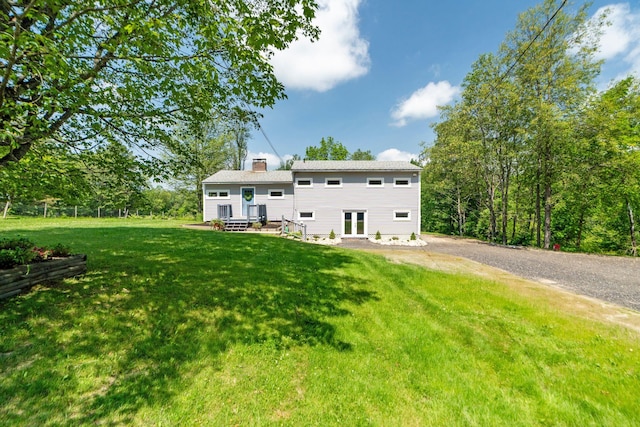 626 County Rd, New London, NH 03257 - back of property featuring a chimney and a lawn