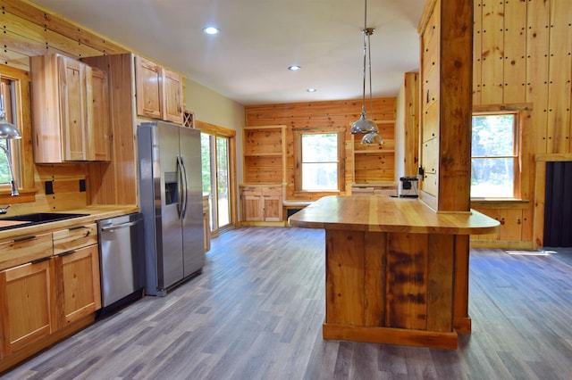00 Serenity Ln, Lisbon, NH 03585 - kitchen with appliances with stainless steel finishes, butcher block countertops, wooden walls, wood finished floors, and recessed lighting