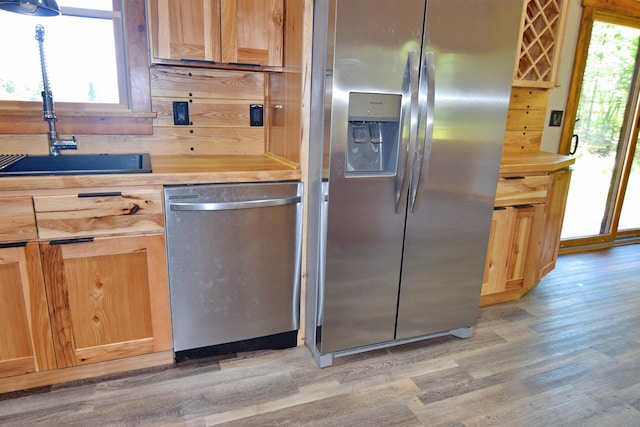 00 Serenity Ln, Lisbon, NH 03585 - kitchen featuring stainless steel appliances, light wood-type flooring, and light brown cabinetry