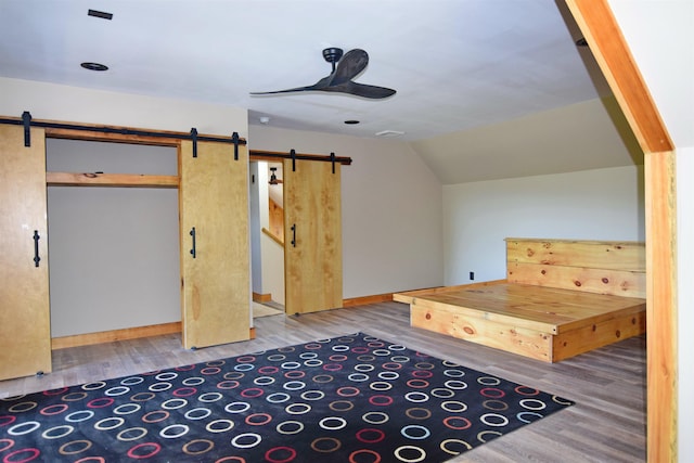 00 Serenity Ln, Lisbon, NH 03585 - bonus room with a barn door, wood finished floors, ceiling fan, and lofted ceiling