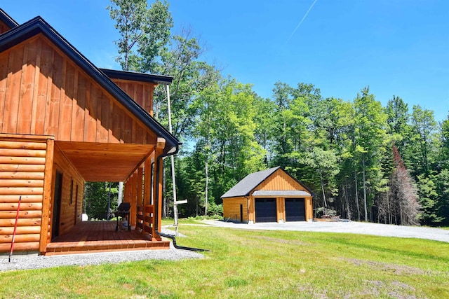 00 Serenity Ln, Lisbon, NH 03585 - view of green lawn with a detached garage, covered porch, and an outbuilding