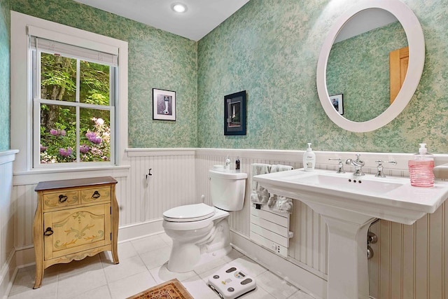 82 Little Cove Rd, New London, NH 03257 - bathroom featuring a wainscoted wall, tile patterned flooring, and wallpapered walls