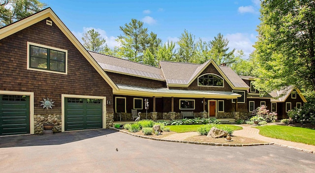 82 Little Cove Rd, New London, NH 03257 - shingle-style home with a porch, asphalt driveway, stone siding, and a standing seam roof