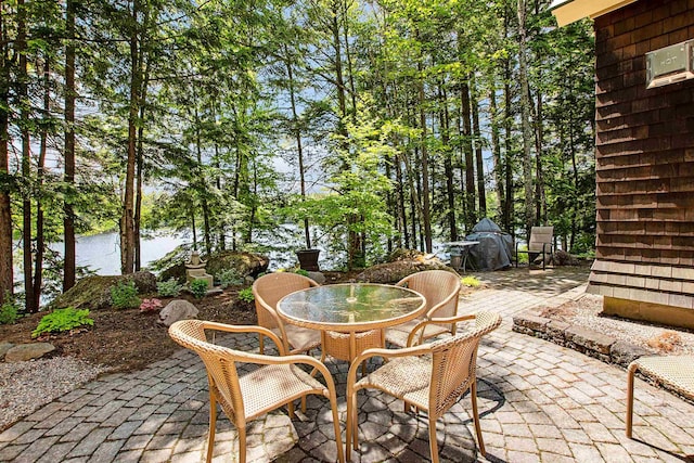 82 Little Cove Rd, New London, NH 03257 - view of patio / terrace featuring outdoor dining space and a water view