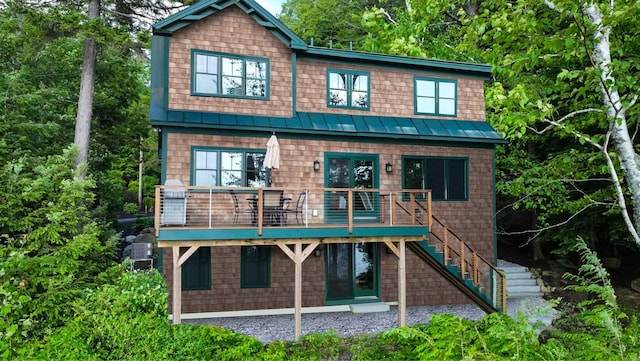 184 Bowles Rd, Newbury, NH 03855 - view of front of home featuring a standing seam roof, a metal roof, and stairway