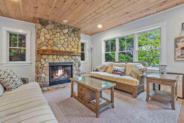 184 Bowles Rd, Newbury, NH 03855 - living area with plenty of natural light, wood ceiling, a stone fireplace, recessed lighting, and ornamental molding