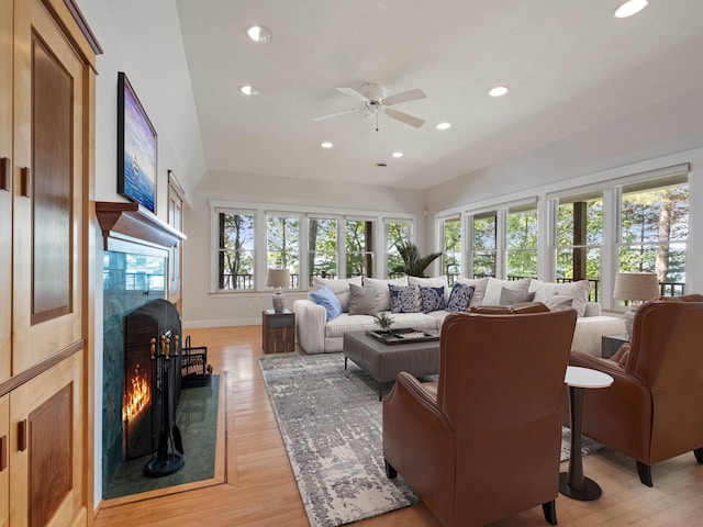 432 Shore Dr, Laconia, NH 03246 - living area with recessed lighting, plenty of natural light, a high end fireplace, light wood-type flooring, and vaulted ceiling