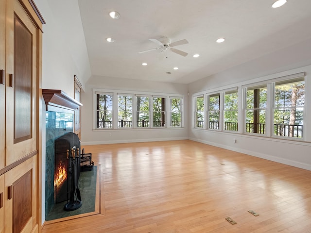 432 Shore Dr, Laconia, NH 03246 - unfurnished living room with a premium fireplace, recessed lighting, a ceiling fan, light wood-type flooring, and lofted ceiling