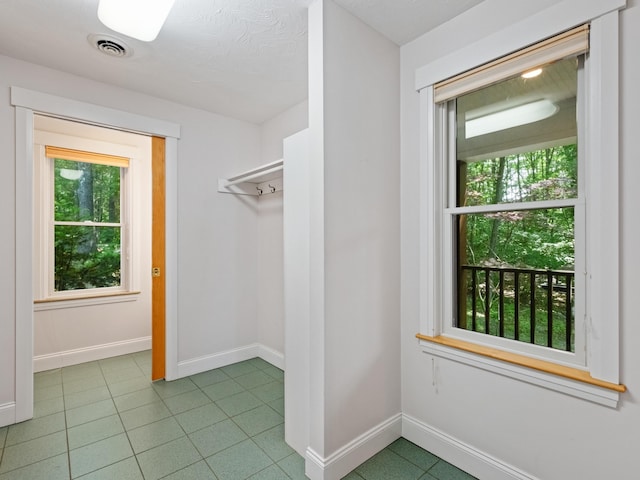 432 Shore Dr, Laconia, NH 03246 - spacious closet featuring tile patterned floors