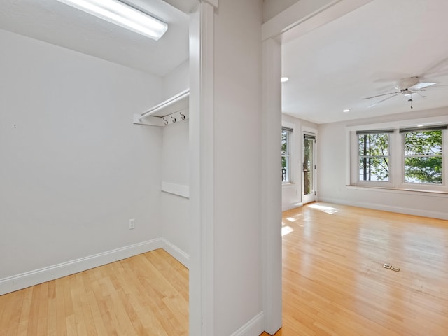 432 Shore Dr, Laconia, NH 03246 - spacious closet with wood finished floors and ceiling fan
