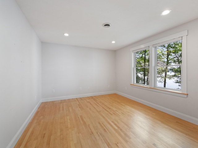 432 Shore Dr, Laconia, NH 03246 - spare room with light wood-style floors and recessed lighting