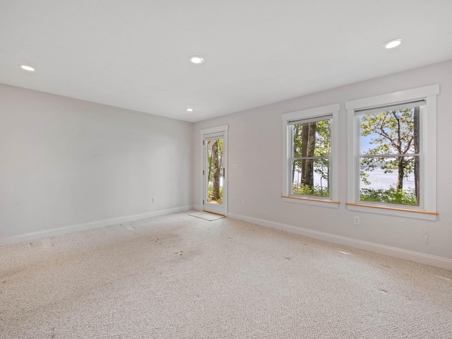 432 Shore Dr, Laconia, NH 03246 - empty room with plenty of natural light, recessed lighting, and light carpet