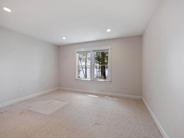 432 Shore Dr, Laconia, NH 03246 - empty room with light carpet and recessed lighting