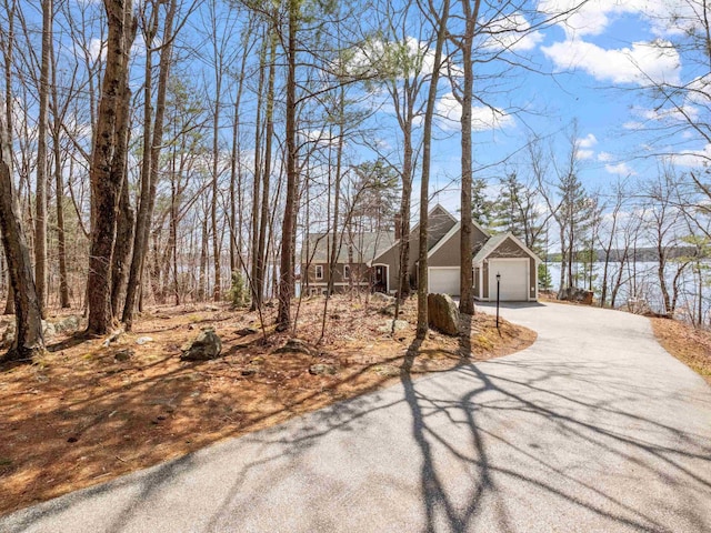 432 Shore Dr, Laconia, NH 03246 - view of side of property featuring driveway and a detached garage