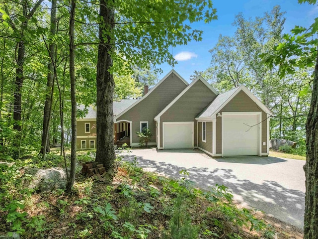 432 Shore Dr, Laconia, NH 03246 - view of front of home featuring a garage and driveway