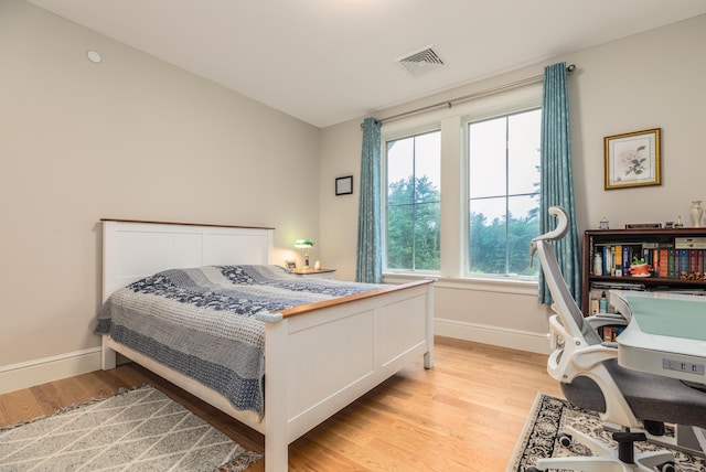 32 Willey Creek Rd Unit 402, Exeter, NH 03833 - bedroom featuring light wood-style flooring and multiple windows