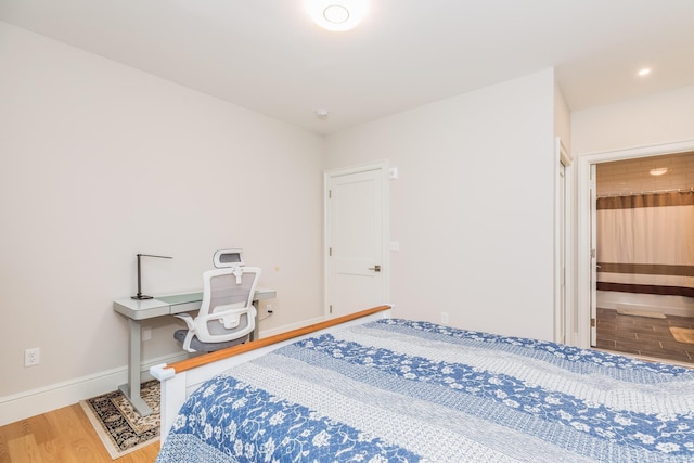 32 Willey Creek Rd Unit 402, Exeter, NH 03833 - bedroom featuring wood finished floors and baseboards
