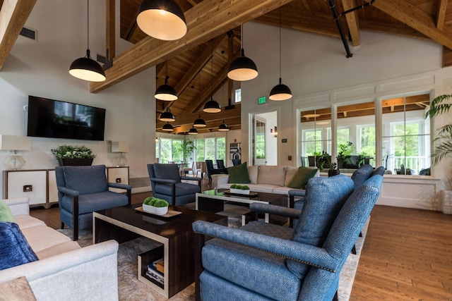 32 Willey Creek Rd Unit 402, Exeter, NH 03833 - living area with high vaulted ceiling, a wooden ceiling with exposed beams, and wood finished floors