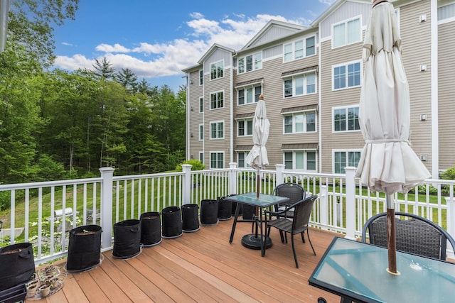 32 Willey Creek Rd Unit 402, Exeter, NH 03833 - wooden terrace with outdoor dining area and a yard