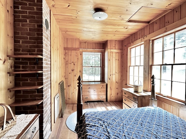32 Pikes Point Rd, Bristol, NH 03222 - bedroom featuring wood ceiling, multiple windows, light wood-style floors, and wood walls