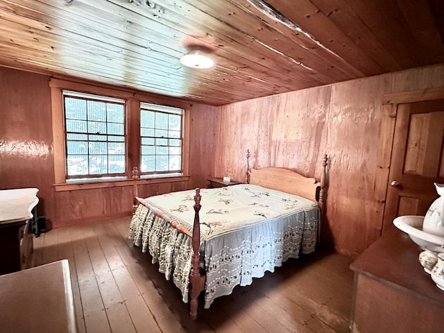 32 Pikes Point Rd, Bristol, NH 03222 - bedroom with wood ceiling, hardwood / wood-style flooring, and wooden walls