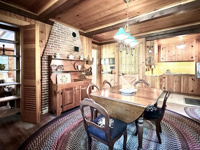 32 Pikes Point Rd, Bristol, NH 03222 - dining space featuring wooden walls, dark wood-type flooring, a wooden ceiling with exposed beams, and a chandelier