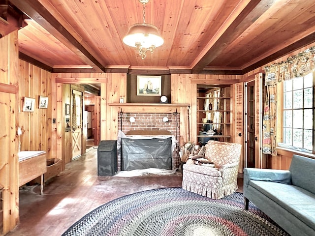 32 Pikes Point Rd, Bristol, NH 03222 - living room featuring wooden walls, a wood ceiling with exposed beams, crown molding, wood finished floors, and a fireplace