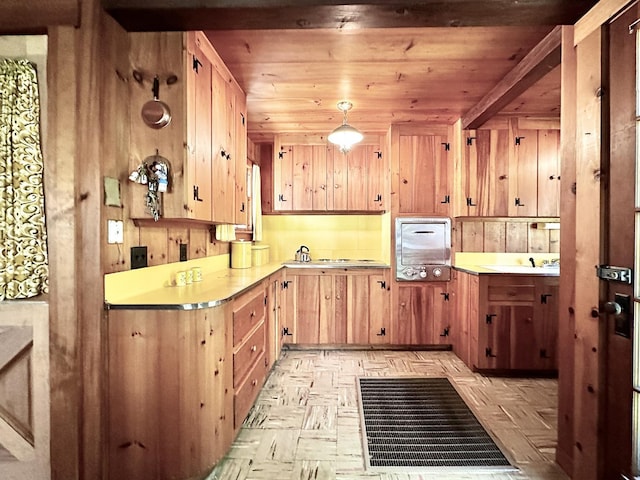 32 Pikes Point Rd, Bristol, NH 03222 - kitchen with light countertops, light brown cabinets, and pendant lighting