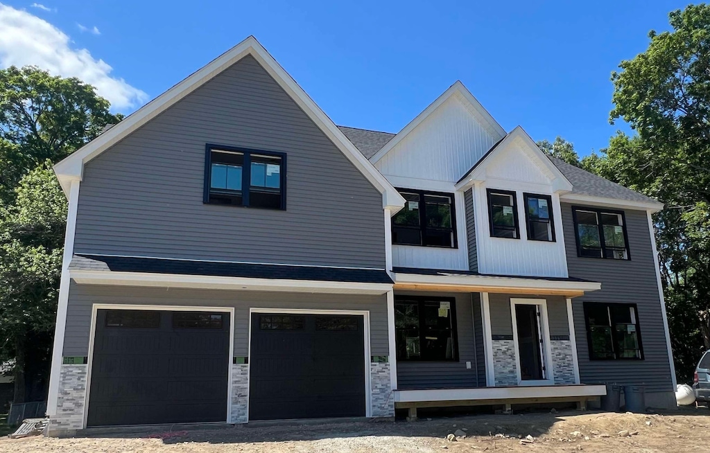 8 Senter St, Salem, NH 03079 - modern farmhouse style home featuring a porch, a garage, and stone siding
