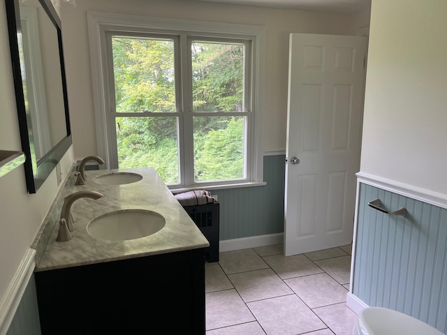 1 Independence Ave, Franklin, NH 03235 - full bathroom with a wainscoted wall, double vanity, and tile patterned flooring