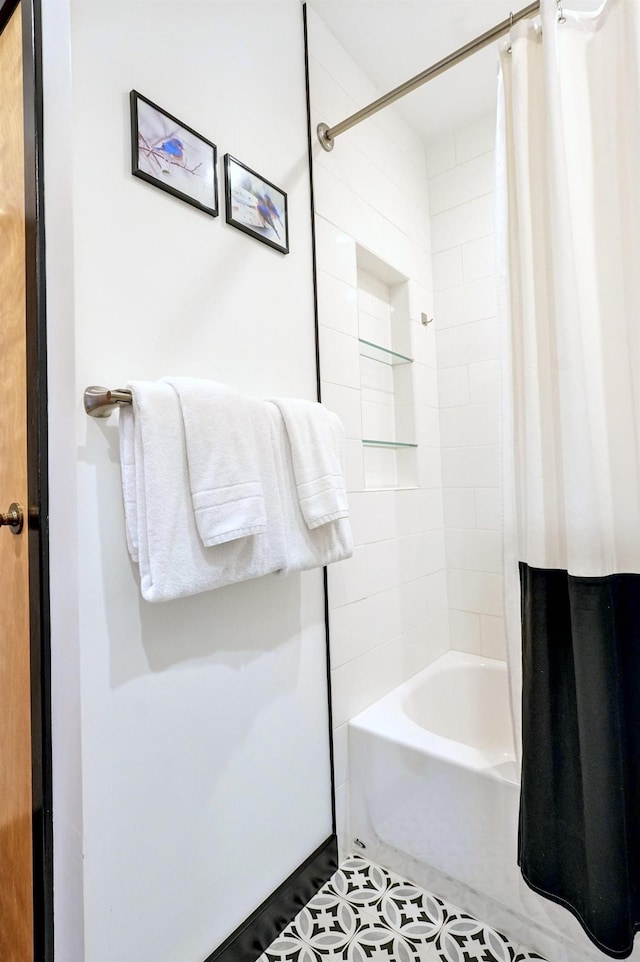 E12 Rock Ridge Rd, Winhall, VT 05340 - bathroom with shower / bath combo with shower curtain and tile patterned flooring