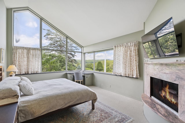 611 Simmons Rd, Andover, VT 05143 - bedroom with lofted ceiling, a fireplace, and carpet
