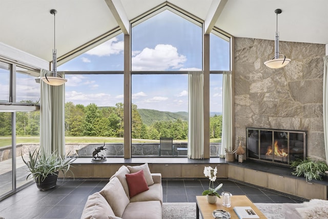 611 Simmons Rd, Andover, VT 05143 - tiled living room featuring a wall of windows, lofted ceiling, and a large fireplace