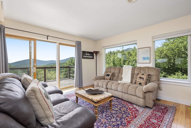 719 Roundabout Rd, Killington, VT 05751 - living room with a mountain view and wood finished floors