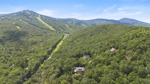 719 Roundabout Rd, Killington, VT 05751 - aerial view of a heavily wooded area and a mountainous background