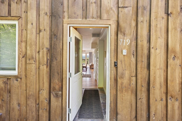 719 Roundabout Rd, Killington, VT 05751 - hall with wood walls and plenty of natural light