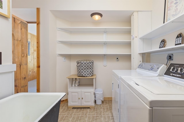 719 Roundabout Rd, Killington, VT 05751 - laundry area featuring baseboards and washing machine and dryer