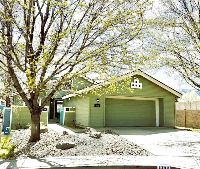 3348 Current Ct, Reno, NV 89509 - view of front of house featuring fence, concrete driveway, and a garage