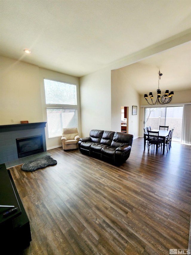 3348 Current Ct, Reno, NV 89509 - living room with a chandelier, a glass covered fireplace, dark wood finished floors, vaulted ceiling, and recessed lighting