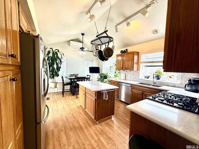 3348 Current Ct, Reno, NV 89509 - kitchen featuring appliances with stainless steel finishes, a sink, a ceiling fan, light countertops, and light wood finished floors