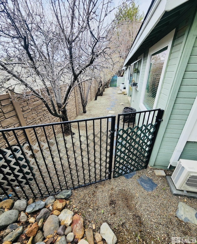 3348 Current Ct, Reno, NV 89509 - view of patio / terrace with a gate, fence, and a cooling unit