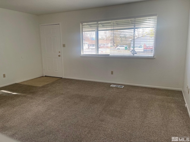 1145 Virbel Ln, Reno, NV 89502 - spare room with plenty of natural light, carpet flooring, and baseboards